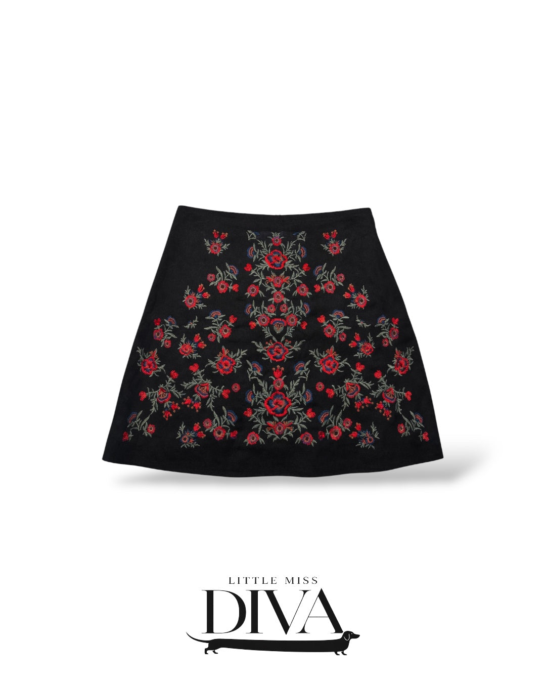 Black mini skirt with red floral embroidery and fitted silhouette