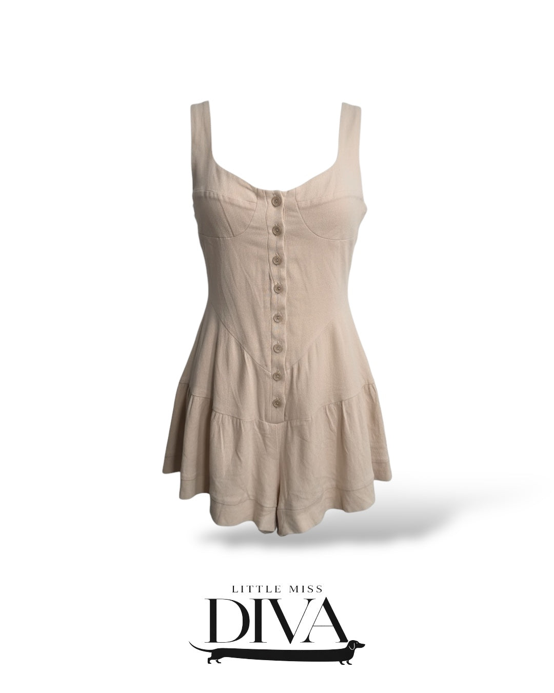 Neutral beige button-front romper with fitted bodice, wide straps, and flared skirt silhouette