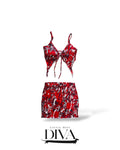 Red abstract print tie-front crop top and matching mini skirt set with asymmetrical hem and statement pattern