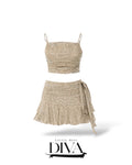 Sage floral two-piece mini set with ruched crop top and wrap skirt

