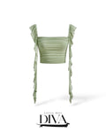 Sage green ruched crop top with ruffle straps and fitted silhouette for birthday and vacation outfits.