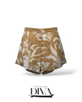 Tan high-waisted shorts with abstract white print and flowy relaxed silhouette