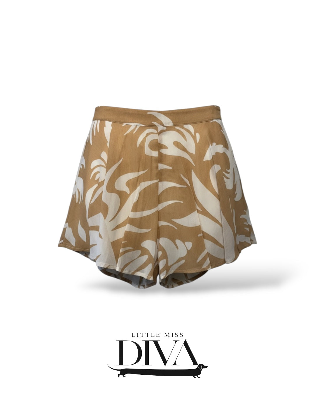Tan high-waisted shorts with abstract white print and flowy relaxed silhouette