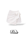 White eyelet wrap mini skort with side tie detail and lightweight textured fabric