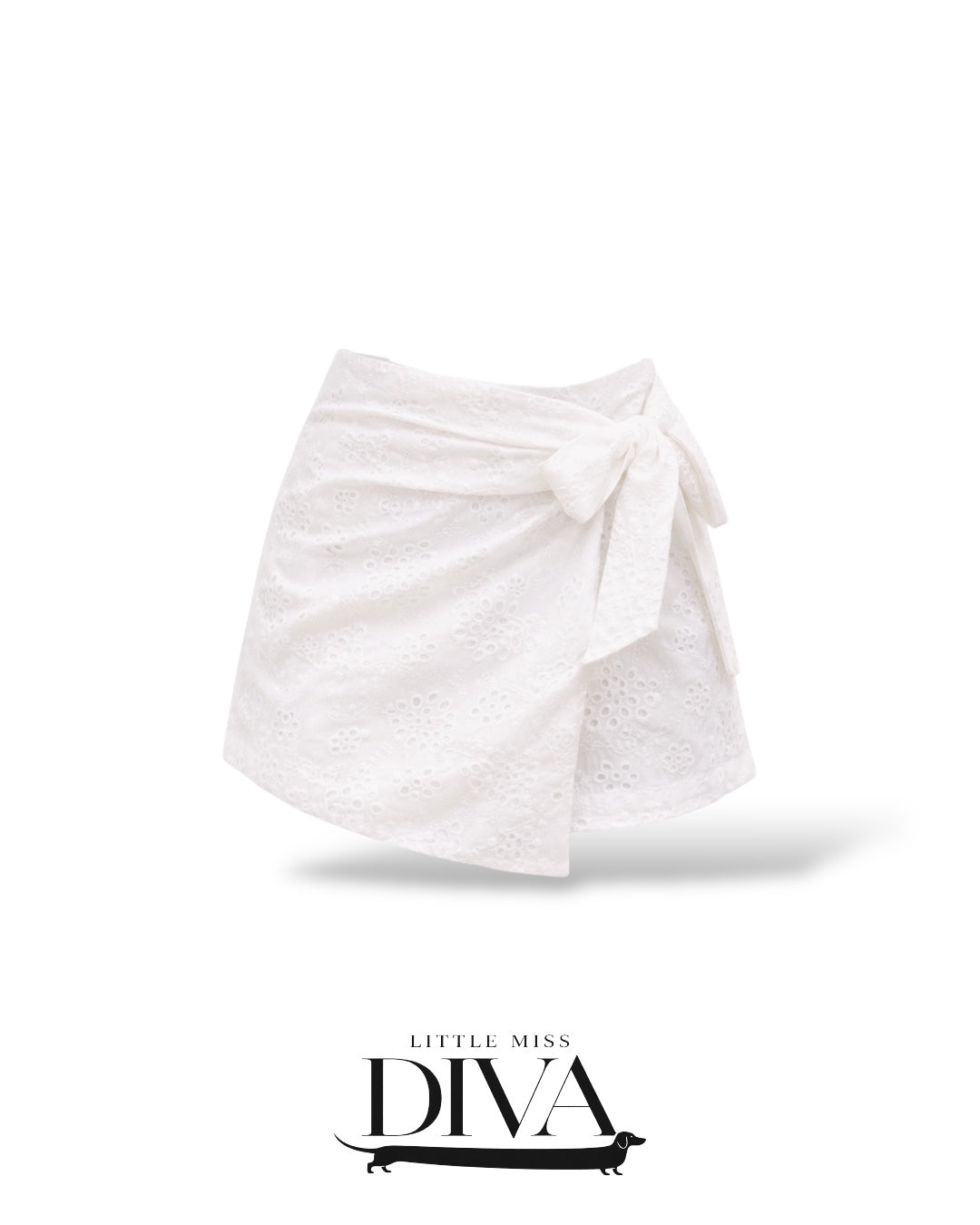White eyelet wrap mini skort with side tie detail and lightweight textured fabric